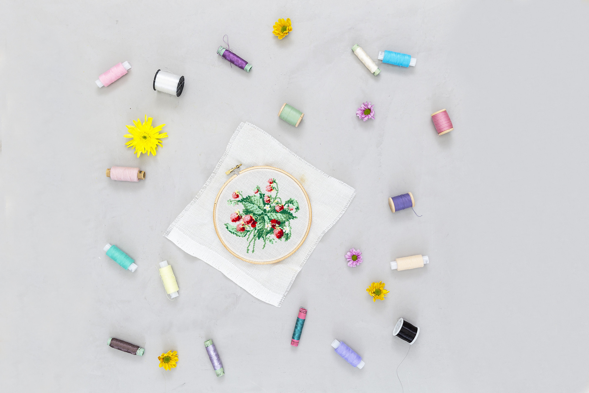 Assorted embroidery kits on table